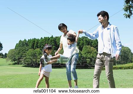 Happy Japanese family in a city park View Large Photo Image Picture - Happy Japanese family in a city park. Fotosearch