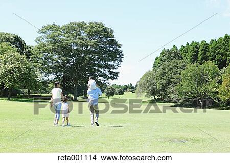 Happy Japanese family in a city park View Large Photo Image Picture - Happy Japanese family in a city park. Fotosearch