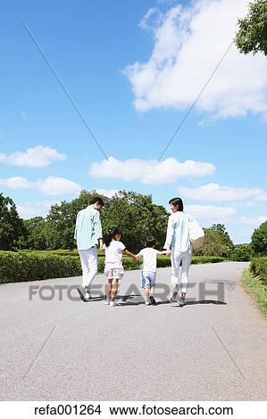 Happy Japanese family in a city park View Large Photo Image Picture - Happy Japanese family in a city park. Fotosearch