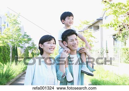 Happy Japanese family in a city park View Large Photo Image Picture - Happy Japanese family in a city park. Fotosearch