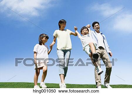 Happy Japanese family in a city park View Large Photo Image Stock Image - Happy Japanese family in a city park. Fotosearch