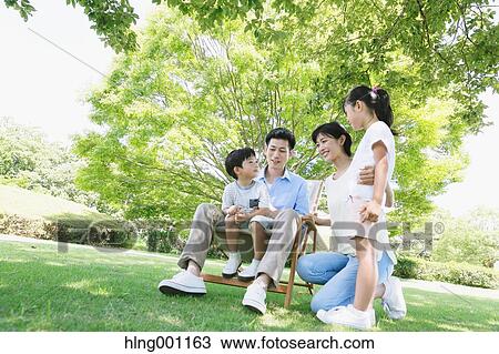 Happy Japanese family in a city park View Large Photo Image Stock Image - Happy Japanese family in a city park. Fotosearch