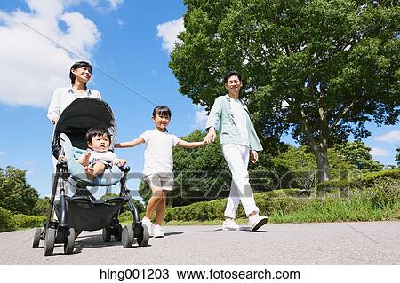 Happy Japanese family in a city park View Large Photo Image Stock Image - Happy Japanese family in a city park. Fotosearch