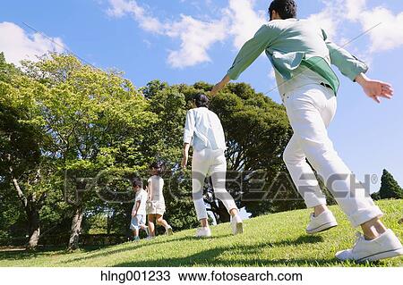 Happy Japanese family in a city park View Large Photo Image Stock Image - Happy Japanese family in a city park. Fotosearch