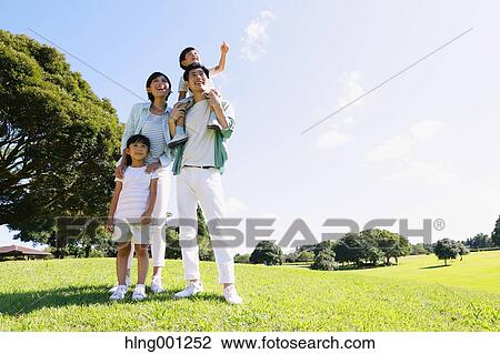 Happy Japanese family in a city park View Large Photo Image Stock Image - Happy Japanese family in a city park. Fotosearch
