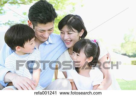 Happy Japanese family in a city park View Large Photo Image Stock Image - Happy Japanese family in a city park. Fotosearch