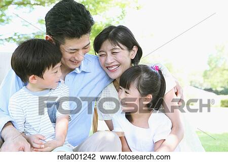 Happy Japanese family in a city park View Large Photo Image Stock Image - Happy Japanese family in a city park. Fotosearch