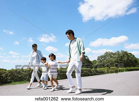 Happy Japanese family in a city park View Large Photo Image Stock Image - Happy Japanese family in a city park. Fotosearch