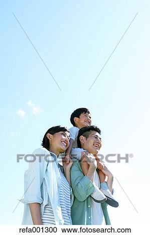 Happy Japanese family in a city park View Large Photo Image Stock Image - Happy Japanese family in a city park. Fotosearch