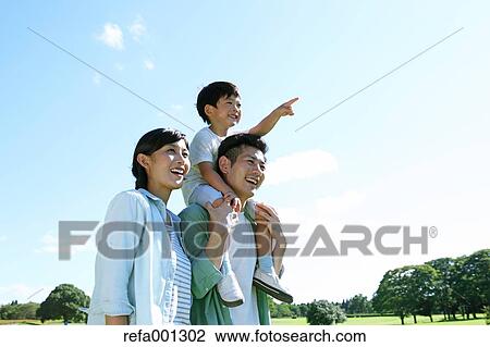 Happy Japanese family in a city park View Large Photo Image Stock Image - Happy Japanese family in a city park. Fotosearch