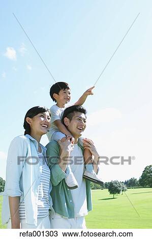 Happy Japanese family in a city park View Large Photo Image Stock Image - Happy Japanese family in a city park. Fotosearch