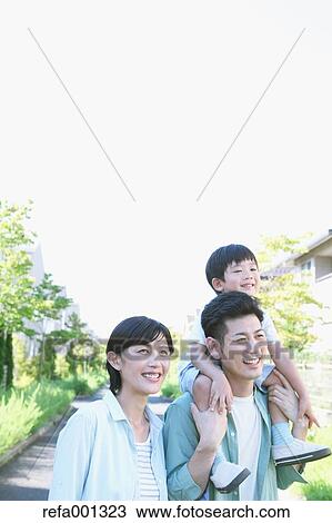 Happy Japanese family in a city park View Large Photo Image Stock Image - Happy Japanese family in a city park. Fotosearch