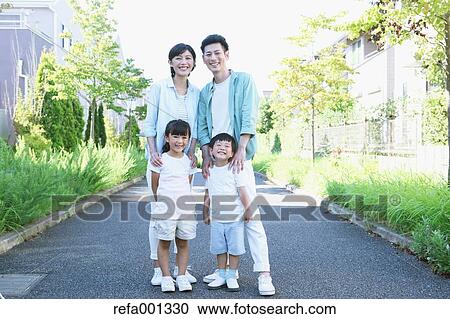 Happy Japanese family in a city park View Large Photo Image Stock Image - Happy Japanese family in a city park. Fotosearch