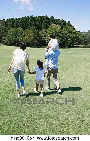 Happy Japanese family in a city park View Large Photo Image Stock Photo - Happy Japanese family in a city park. Fotosearch