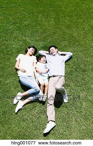 Stock Photo - Happy Japanese family in a city park. Fotosearch