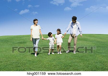 Happy Japanese family in a city park View Large Photo Image Stock Photo - Happy Japanese family in a city park. Fotosearch