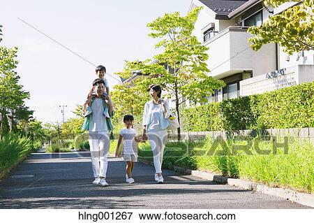 Happy Japanese family in a city park View Large Photo Image Stock Photo - Happy Japanese family in a city park. Fotosearch