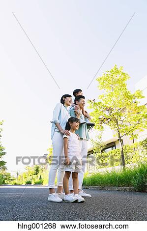 Happy Japanese family in a city park View Large Photo Image Stock Photo - Happy Japanese family in a city park. Fotosearch