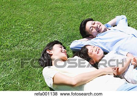 Happy Japanese family in a city park View Large Photo Image Stock Photo - Happy Japanese family in a city park. Fotosearch