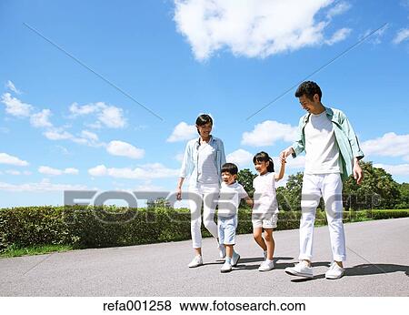 Happy Japanese family in a city park View Large Photo Image Stock Photo - Happy Japanese family in a city park. Fotosearch