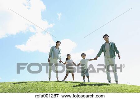 Happy Japanese family in a city park View Large Photo Image Stock Photo - Happy Japanese family in a city park. Fotosearch