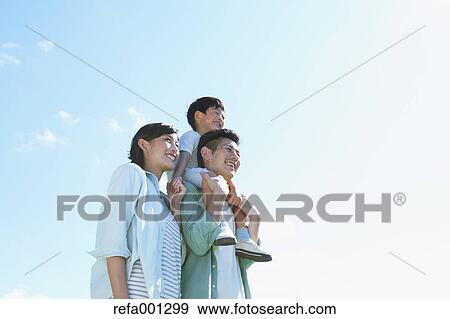Happy Japanese family in a city park View Large Photo Image Stock Photo - Happy Japanese family in a city park. Fotosearch