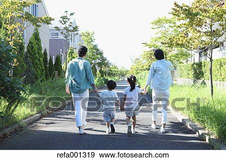 Happy Japanese family in a city park View Large Photo Image Stock Photo - Happy Japanese family in a city park. Fotosearch