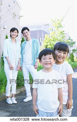 Happy Japanese family in a city park View Large Photo Image Stock Photo - Happy Japanese family in a city park. Fotosearch