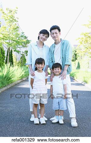 Happy Japanese family in a city park View Large Photo Image Stock Photo - Happy Japanese family in a city park. Fotosearch