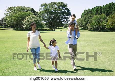Happy Japanese family in a city park View Large Photo Image Stock Photograph - Happy Japanese family in a city park. Fotosearch