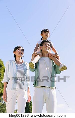 Happy Japanese family in a city park View Large Photo Image Stock Photograph - Happy Japanese family in a city park. Fotosearch