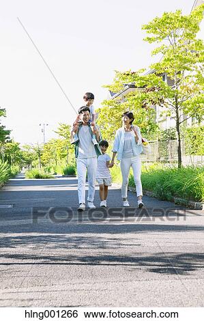 Happy Japanese family in a city park View Large Photo Image Stock Photograph - Happy Japanese family in a city park. Fotosearch
