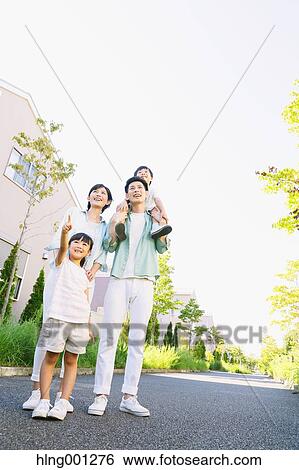 Happy Japanese family in a city park View Large Photo Image Stock Photograph - Happy Japanese family in a city park. Fotosearch
