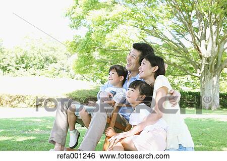 Happy Japanese family in a city park View Large Photo Image Stock Photograph - Happy Japanese family in a city park. Fotosearch