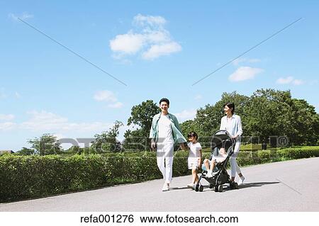 Happy Japanese family in a city park View Large Photo Image Stock Photograph - Happy Japanese family in a city park. Fotosearch