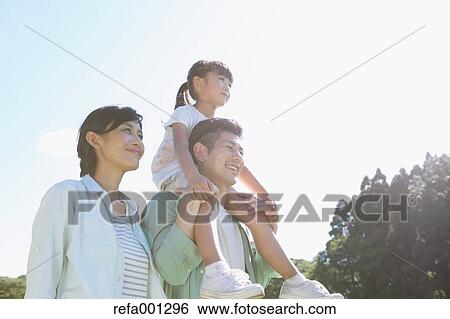 Happy Japanese family in a city park View Large Photo Image Stock Photograph - Happy Japanese family in a city park. Fotosearch