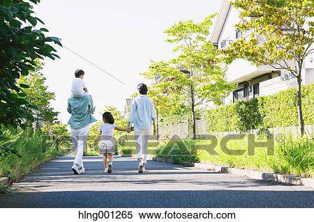 Stock Photography - Happy Japanese family in a city park. Fotosearch