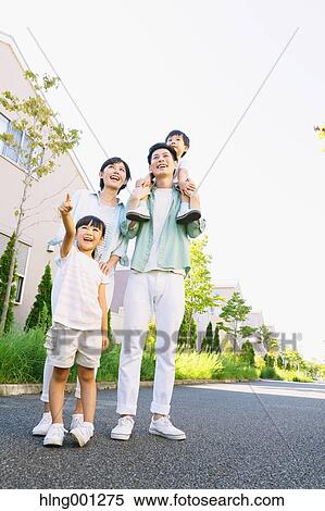 Happy Japanese family in a city park View Large Photo Image Stock Photography - Happy Japanese family in a city park. Fotosearch