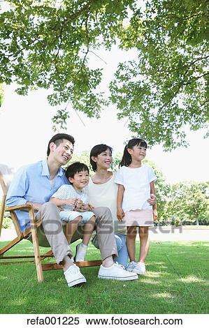 Happy Japanese family in a city park View Large Photo Image Stock Photography - Happy Japanese family in a city park. Fotosearch