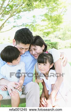 Happy Japanese family in a city park View Large Photo Image Stock Photography - Happy Japanese family in a city park. Fotosearch