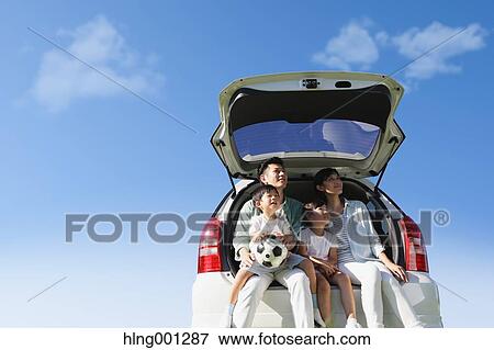 Happy Japanese family with car and blue sky View Large Photo Image Stock Photo - Happy Japanese family with car and blue sky. Fotosearch