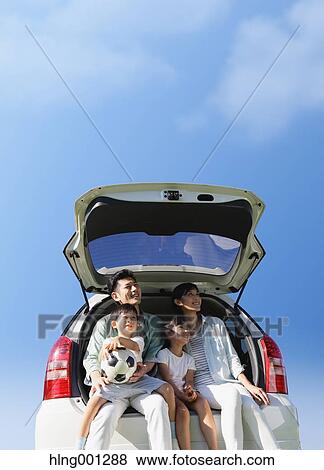 Happy Japanese family with car and blue sky View Large Photo Image Stock Photo - Happy Japanese family with car and blue sky. Fotosearch