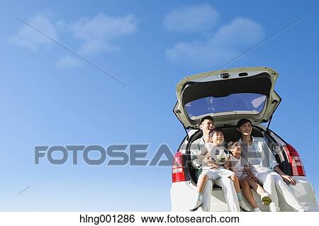 Happy Japanese family with car and blue sky View Large Photo Image Stock Photograph - Happy Japanese family with car and blue sky. Fotosearch