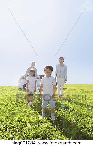 Happy Japanese family with car in a city park View Large Photo Image Picture - Happy Japanese family with car in a city park. Fotosearch
