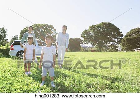 Happy Japanese family with car in a city park View Large Photo Image Stock Image - Happy Japanese family with car in a city park. Fotosearch