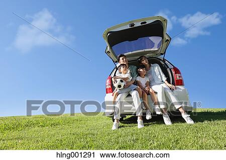 Happy Japanese family with car in a city park View Large Photo Image Stock Image - Happy Japanese family with car in a city park. Fotosearch