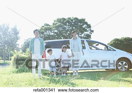 Happy Japanese family with car in a city park View Large Photo Image Stock Image - Happy Japanese family with car in a city park. Fotosearch