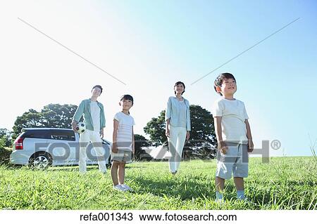 Happy Japanese family with car in a city park View Large Photo Image Stock Image - Happy Japanese family with car in a city park. Fotosearch