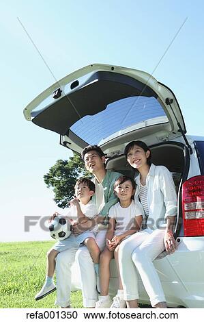 Happy Japanese family with car in a city park View Large Photo Image Stock Image - Happy Japanese family with car in a city park. Fotosearch