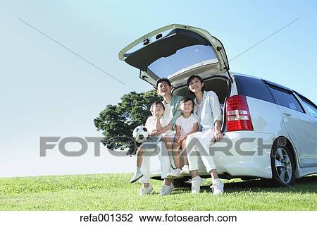 Happy Japanese family with car in a city park View Large Photo Image Stock Image - Happy Japanese family with car in a city park. Fotosearch